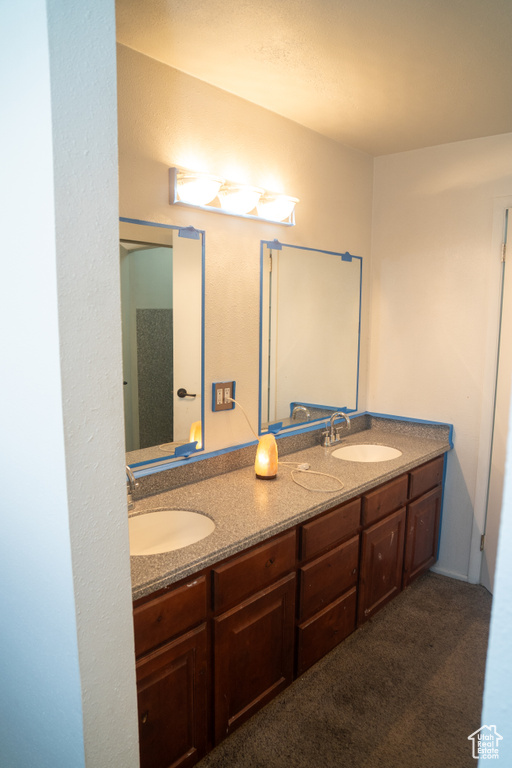 Full bath featuring double vanity