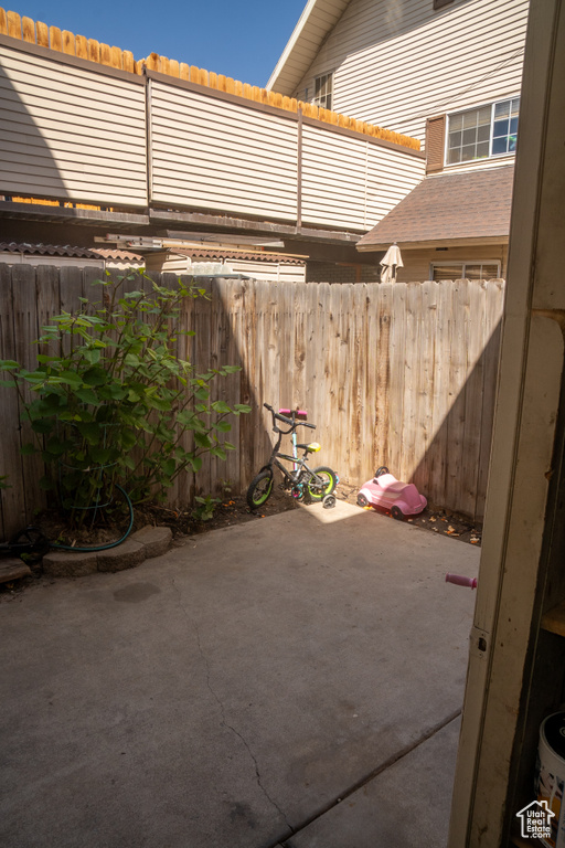 View of patio with fence