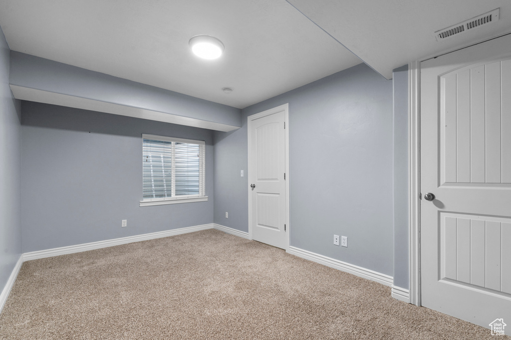 Below grade area featuring carpet floors and baseboards