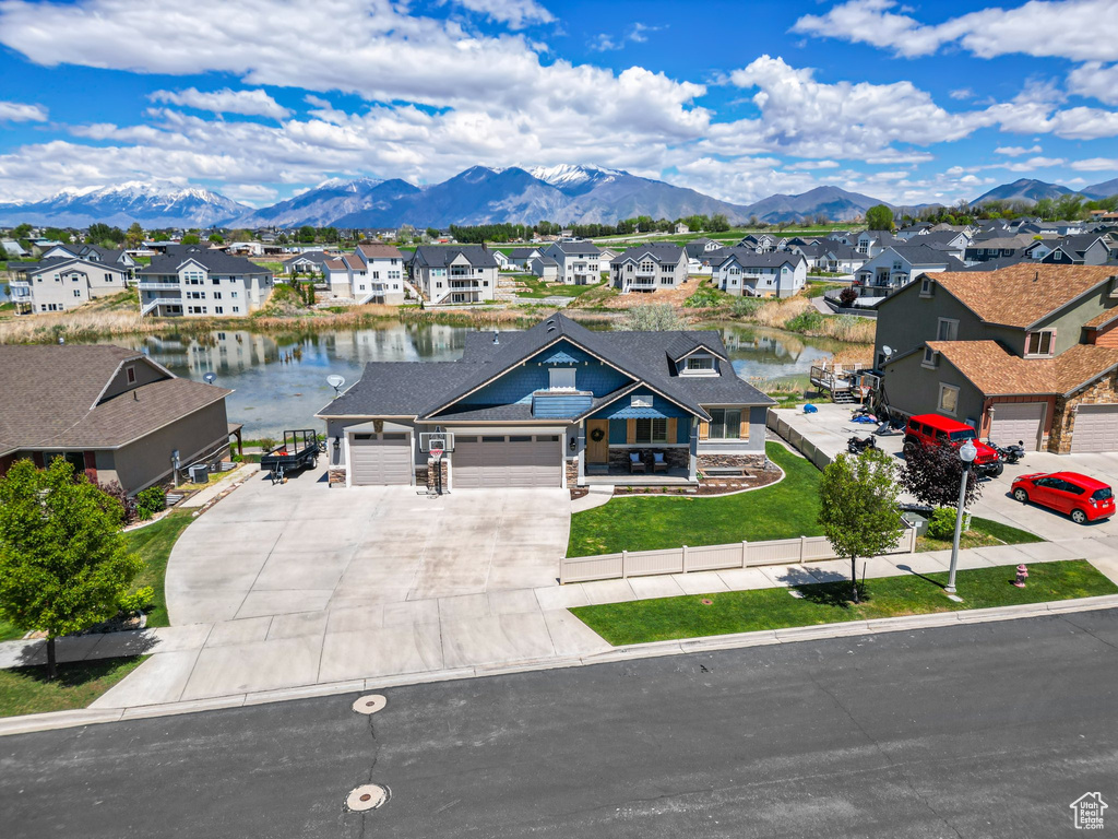 Aerial perspective of suburban area featuring a water and mountain view