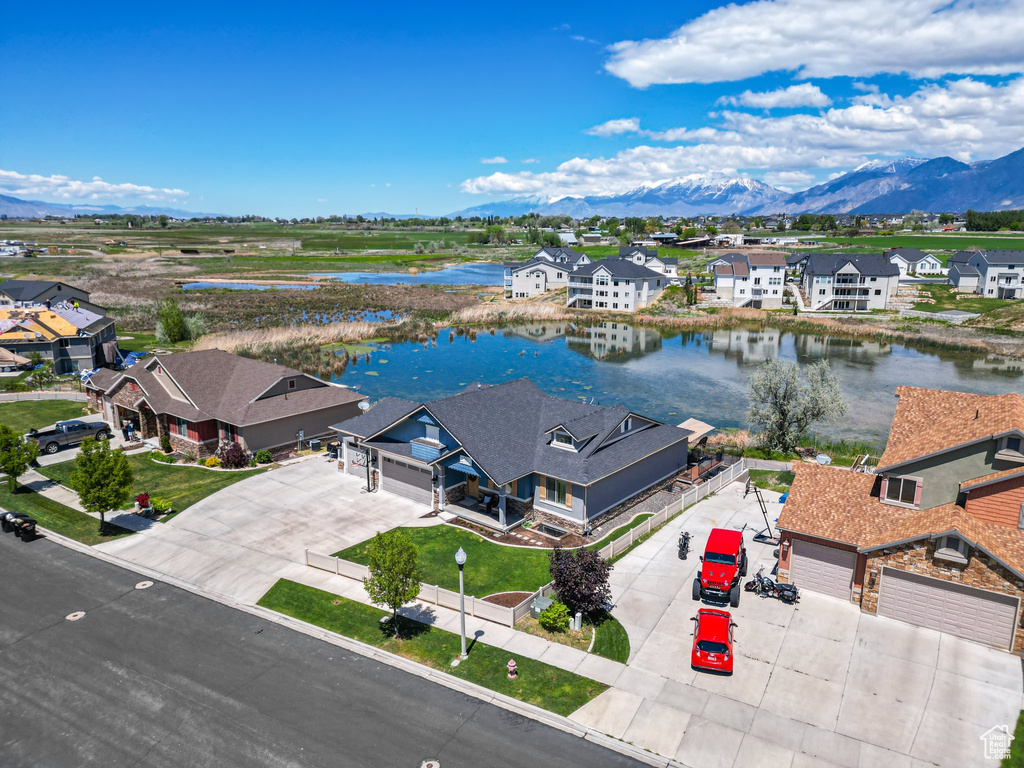 Aerial perspective of suburban area with a water and mountain view