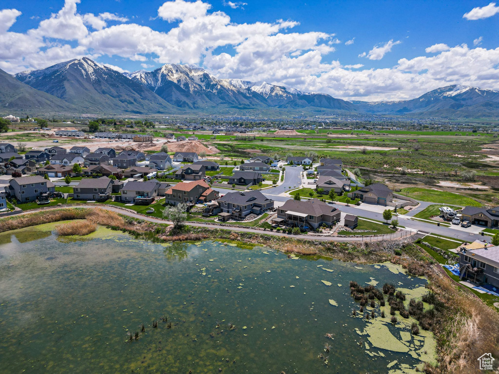 Aerial perspective of suburban area with a water and mountain view