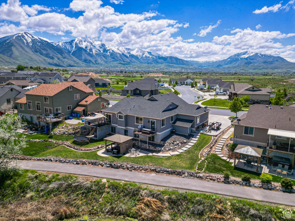 Aerial perspective of suburban area featuring a mountainous background