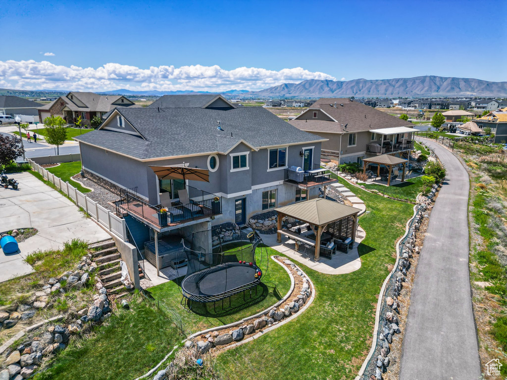 Aerial perspective of suburban area featuring a mountainous background