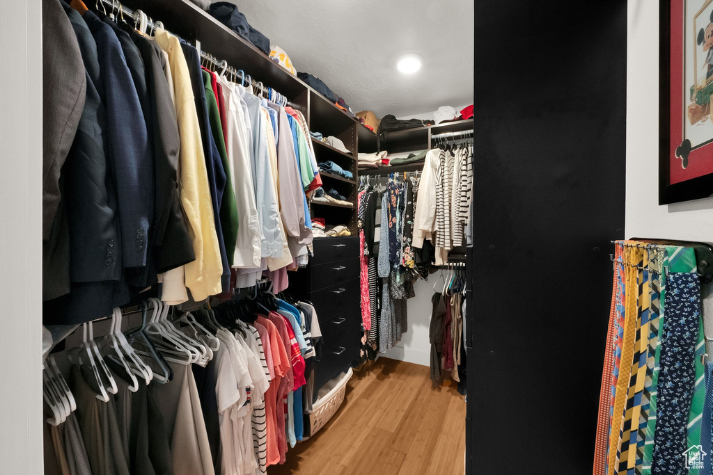 Spacious closet featuring wood finished floors