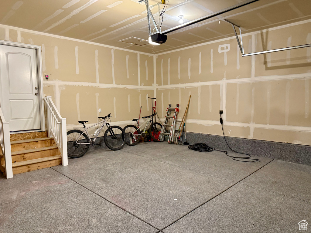 Garage featuring a garage door opener
