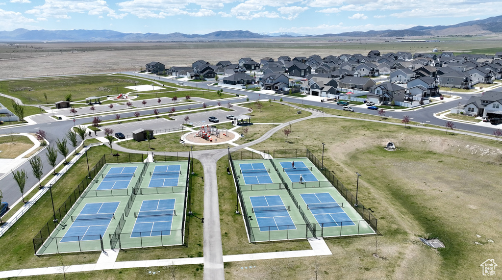Aerial perspective of suburban area featuring a mountain backdrop