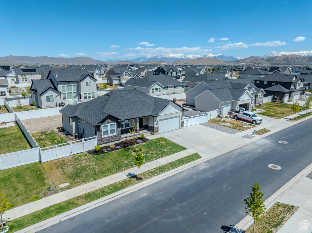 Aerial view of residential area featuring a mountain backdrop