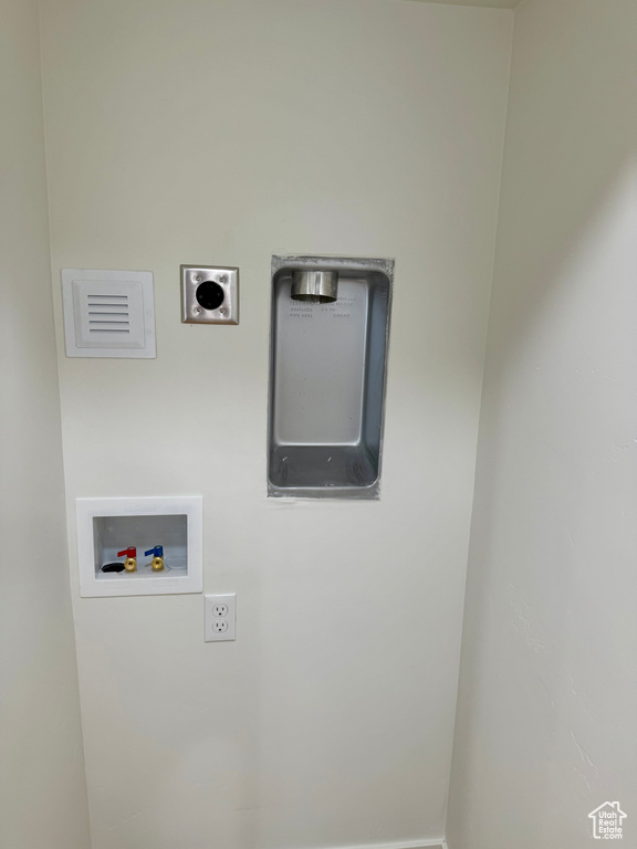 Clothes washing area with electric dryer hookup and hookup for a washing machine