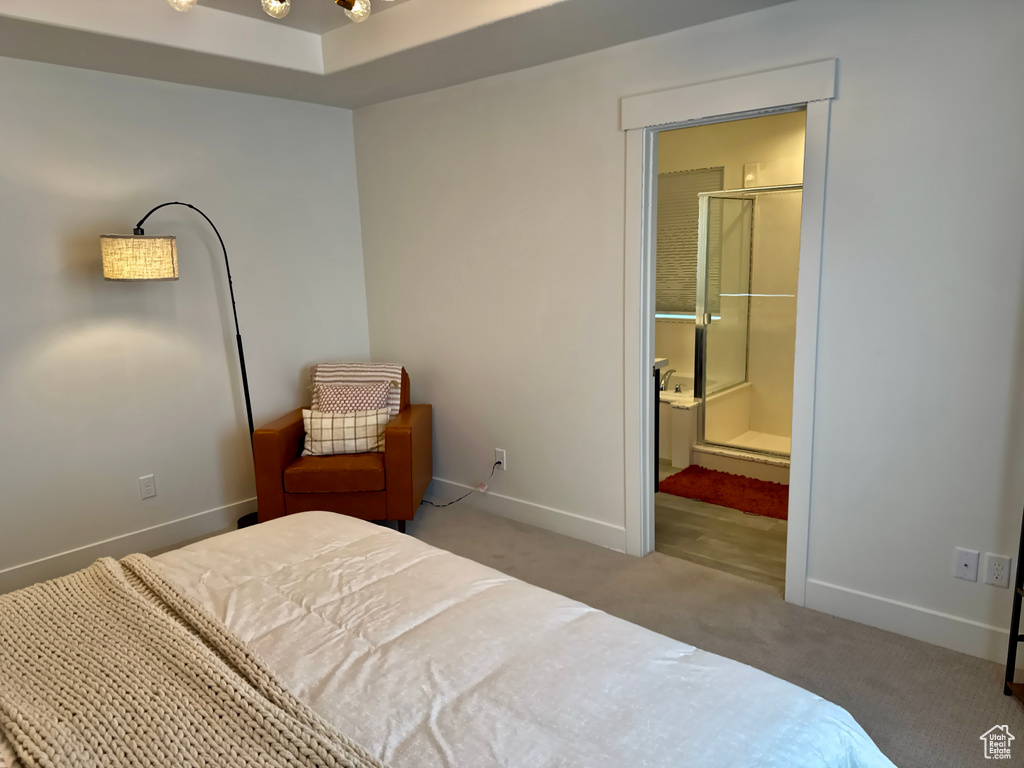 Carpeted bedroom featuring baseboards