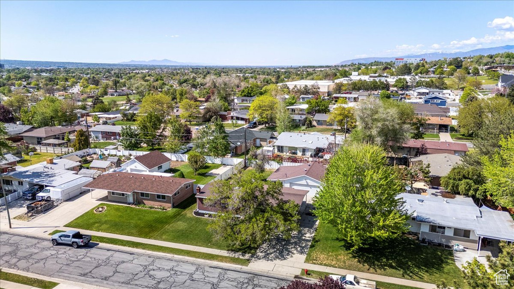 Aerial perspective of suburban area featuring a mountain backdrop