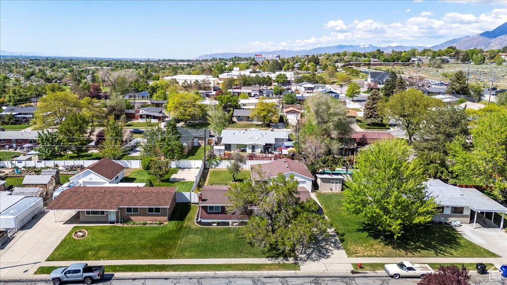 Aerial view of residential area featuring a mountain backdrop