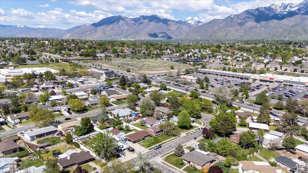Aerial overview of property's location with a mountainous background