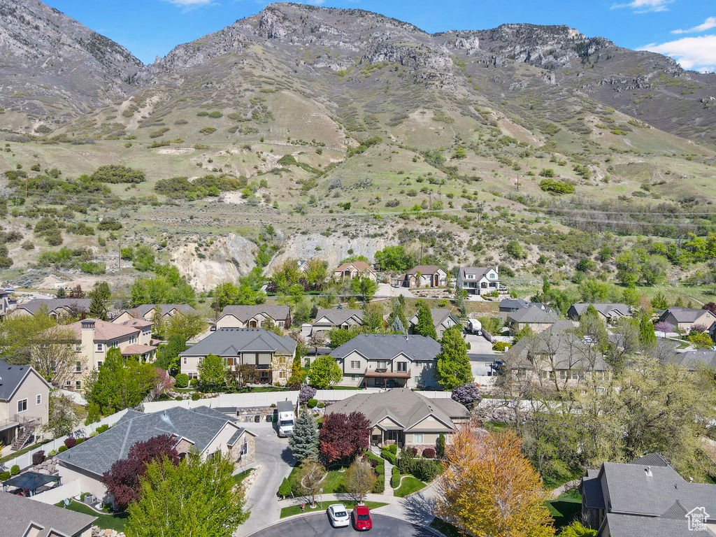 Birds eye view of property with a residential view and a mountain view