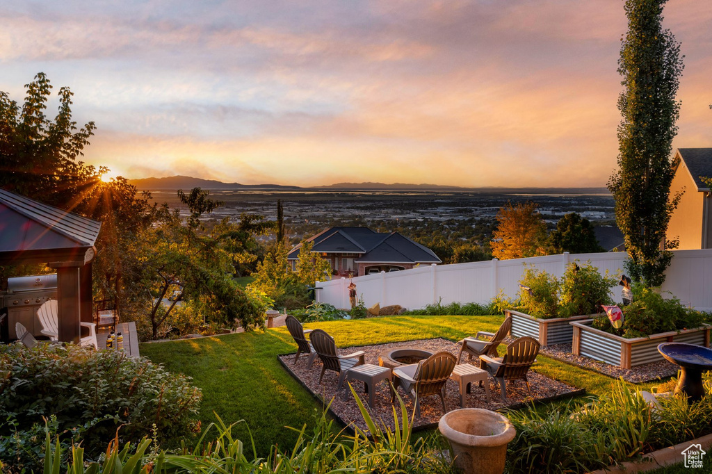 View of yard with a garden and a mountain view