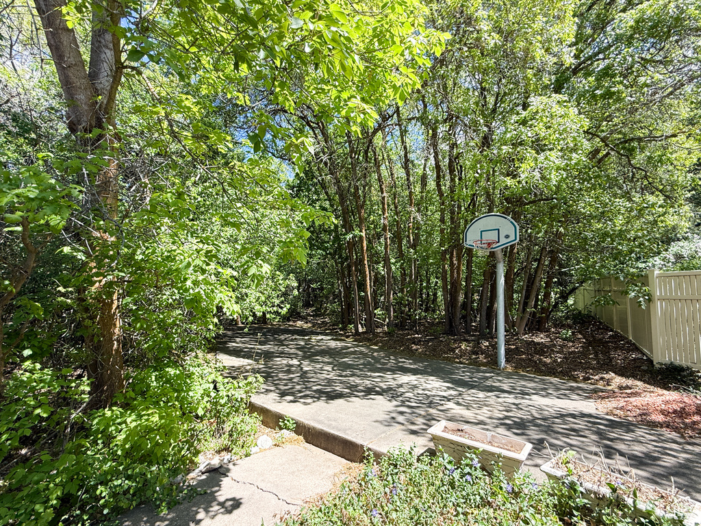 View of patio / terrace with fence and basketball court