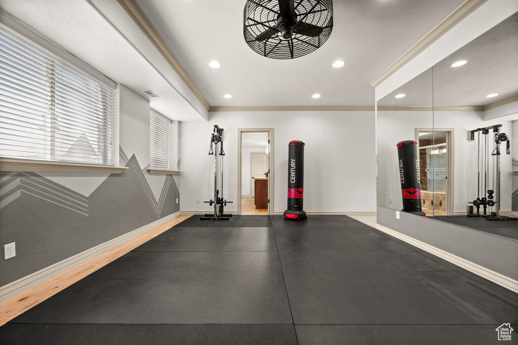 Workout area with baseboards, recessed lighting, and ornamental molding