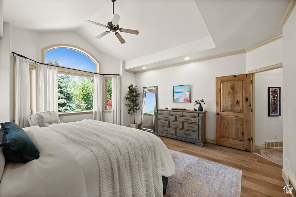 Bedroom featuring wood finished floors, a ceiling fan, recessed lighting, high vaulted ceiling, and baseboards