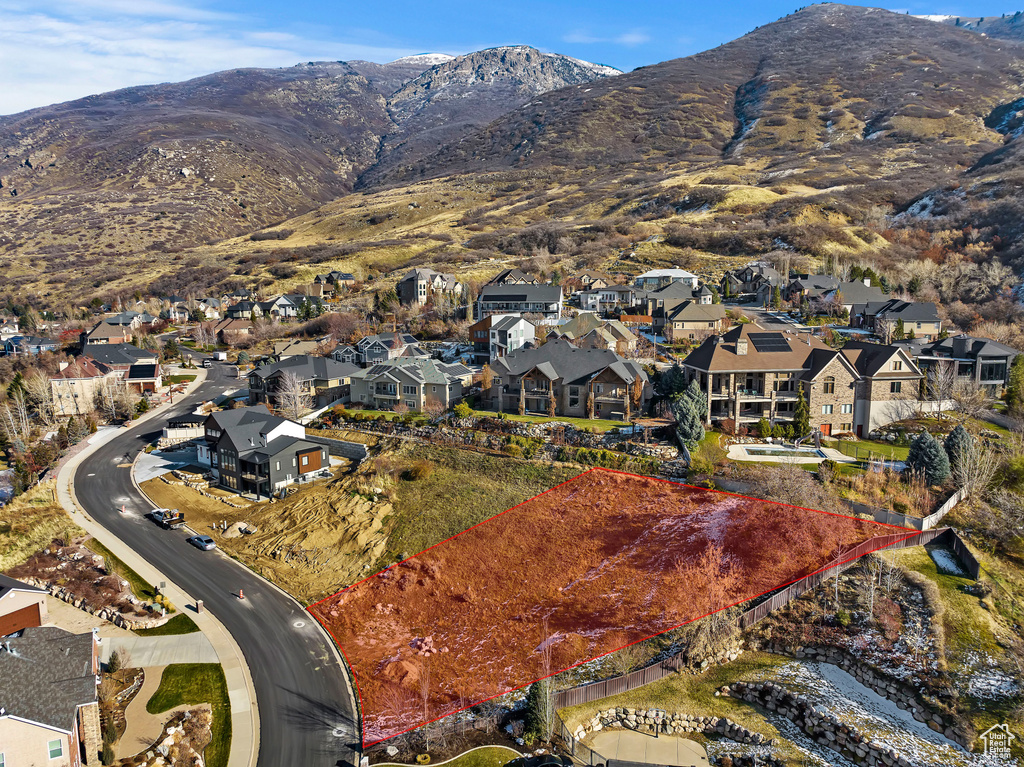 Aerial view of residential area featuring mountains