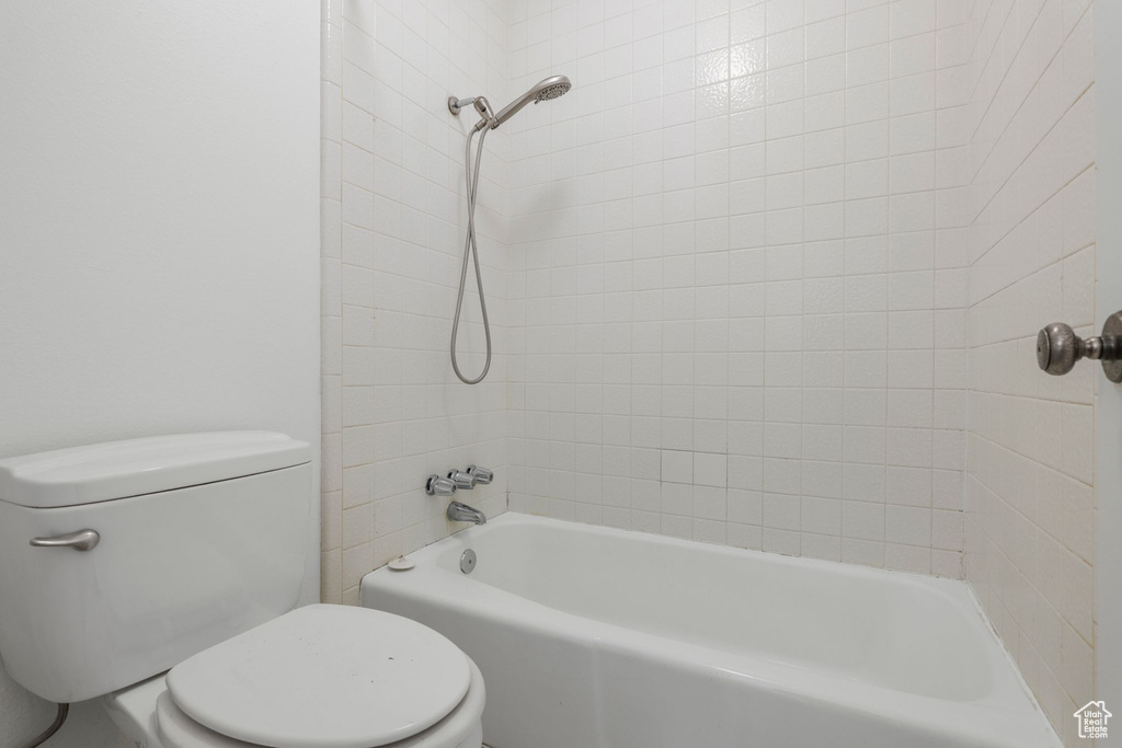 Bathroom with toilet and shower / tub combination