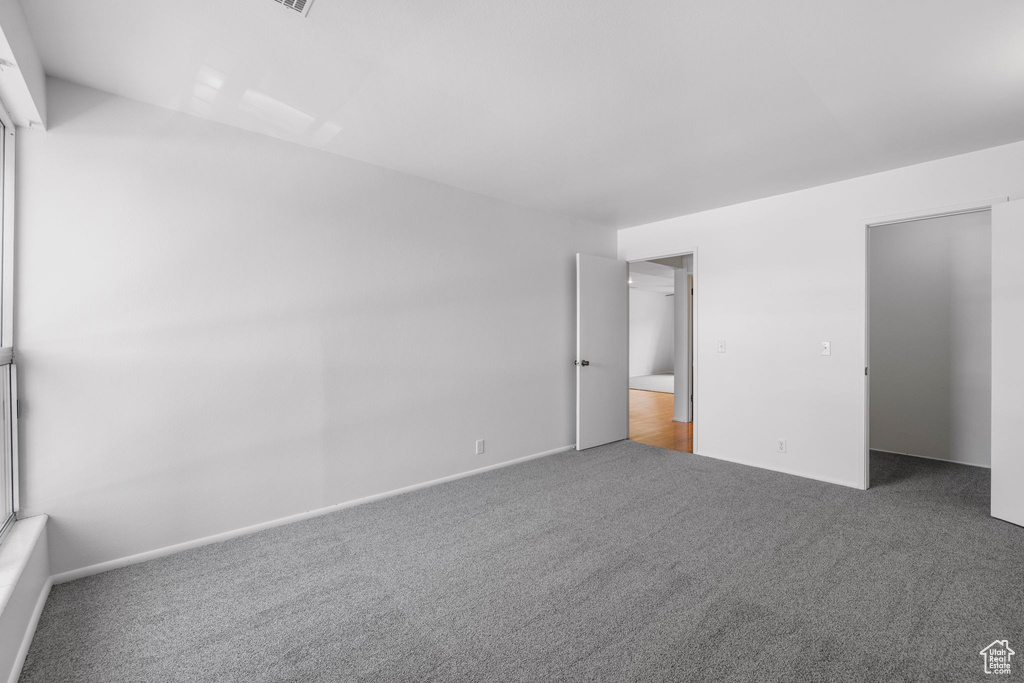 Unfurnished bedroom with carpet floors