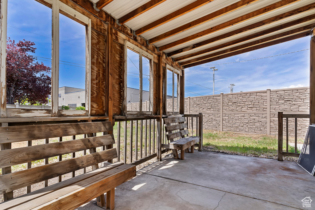 View of patio with fence