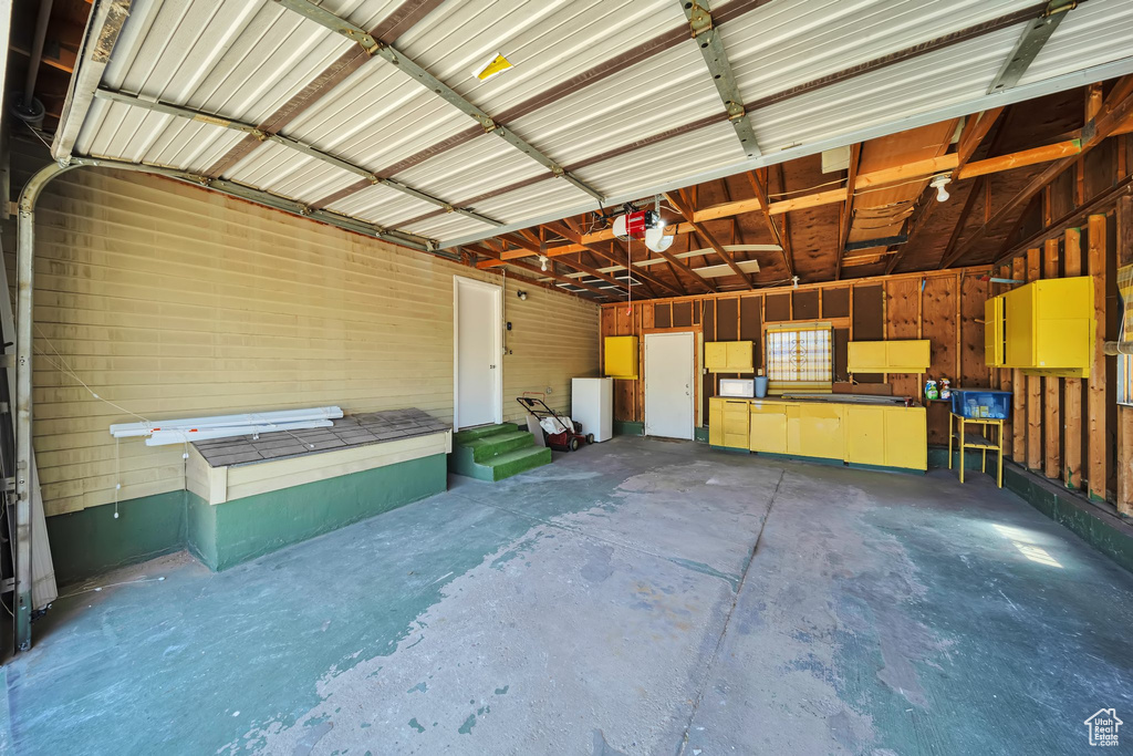 Garage featuring a garage door opener
