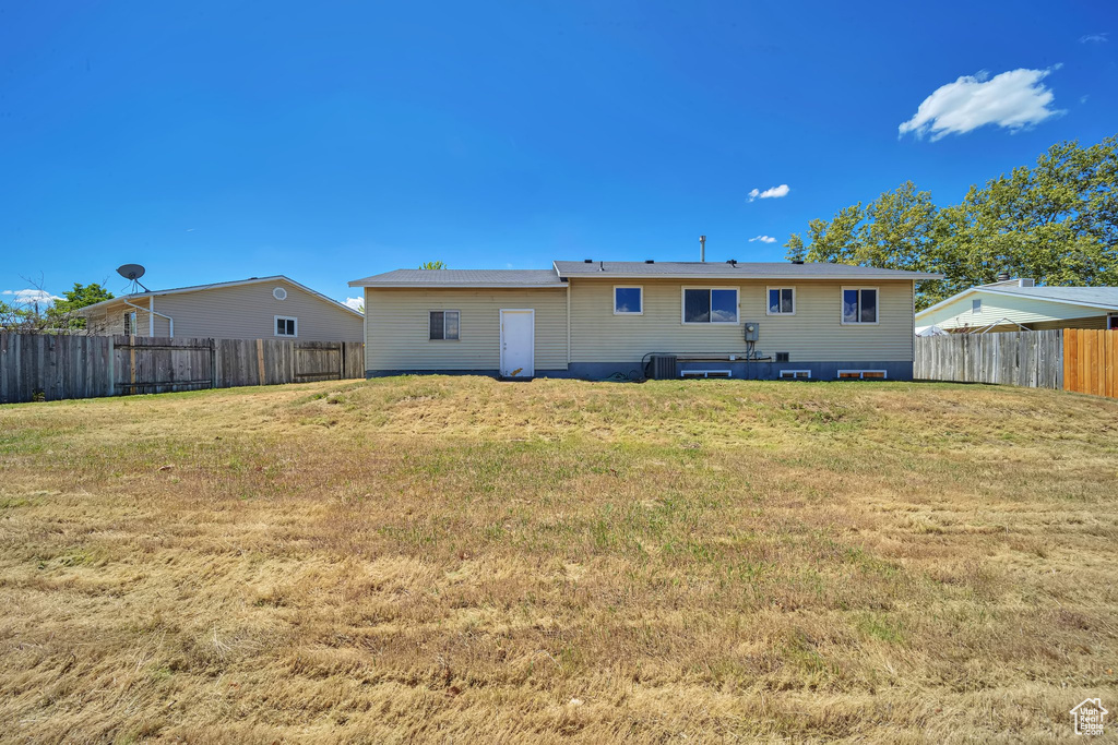 Rear view of house featuring central AC unit