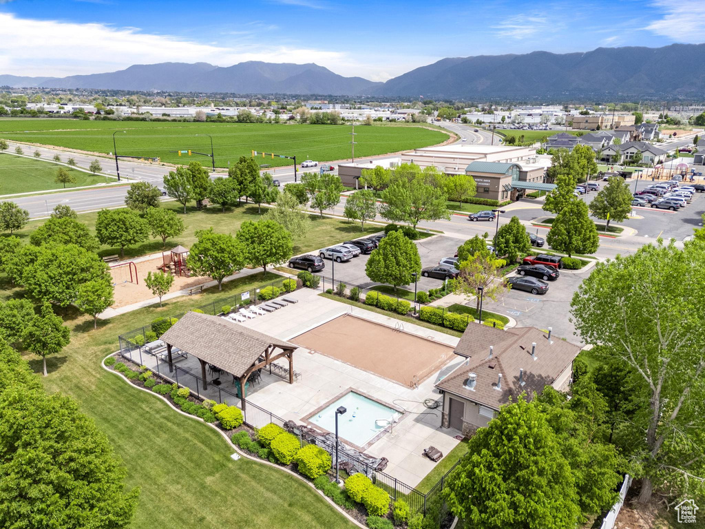 Drone / aerial view of a mountainous background and a pool