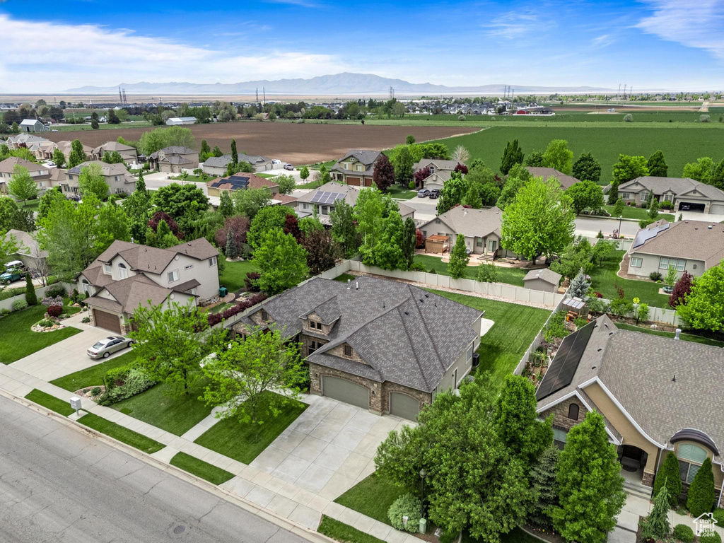 Aerial perspective of suburban area featuring a mountainous background