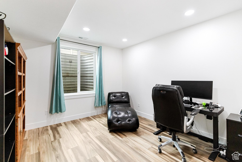 Office with wood finished floors, baseboards, and recessed lighting