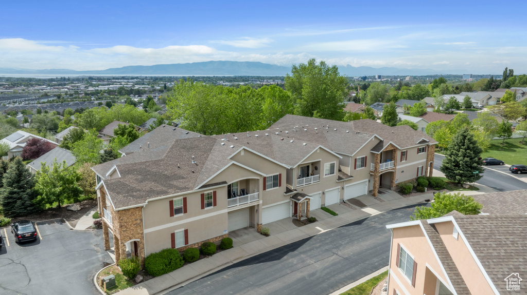Aerial view of residential area featuring mountains