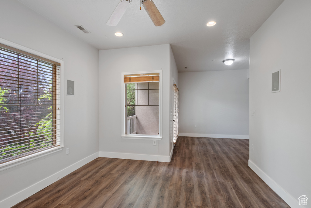 Unfurnished room featuring wood finished floors, baseboards, recessed lighting, and ceiling fan
