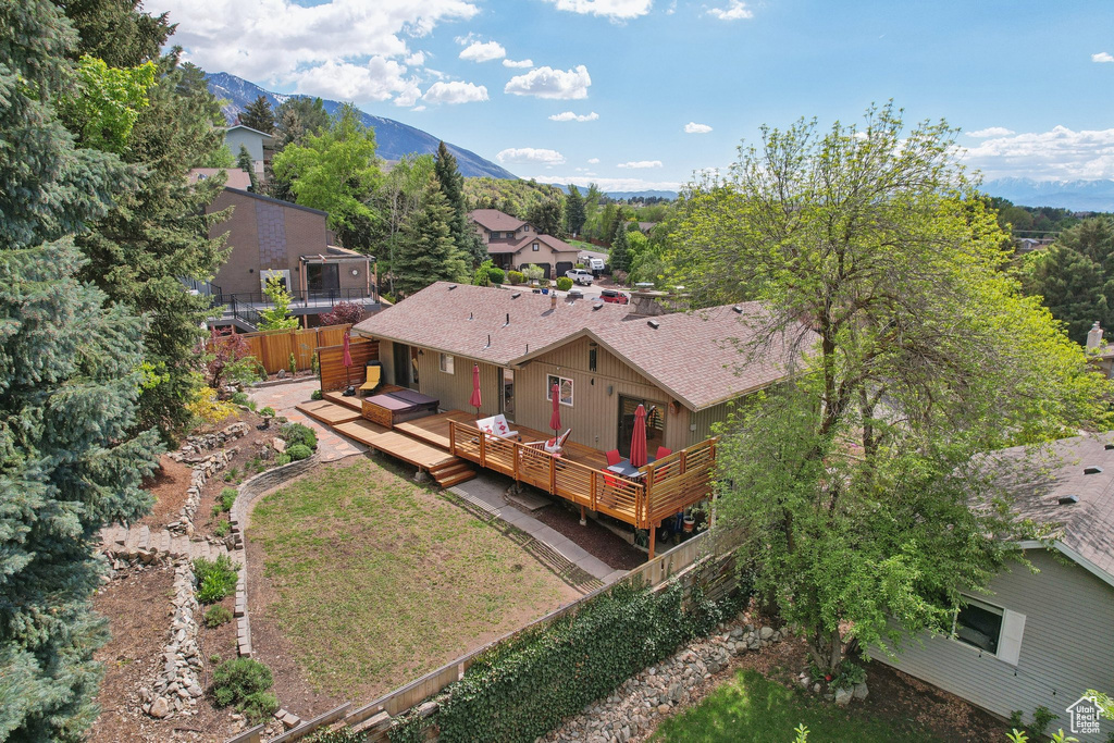 View of subject property featuring a mountainous background