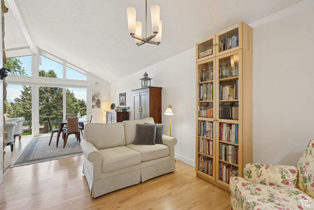 Living room featuring a chandelier and light wood-type flooring