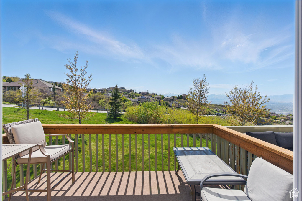 Wooden terrace with a lawn