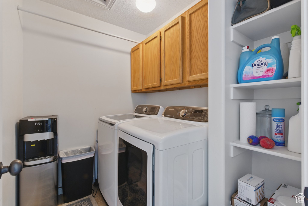 Clothes washing area with washing machine and clothes dryer and cabinet space