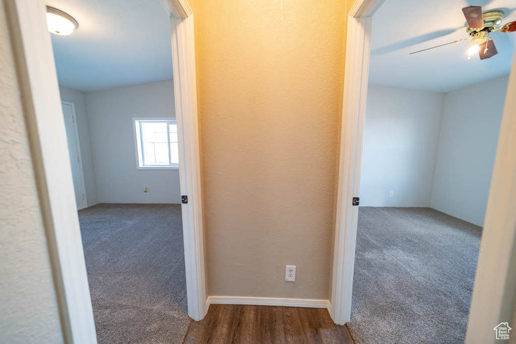 Corridor featuring carpet floors