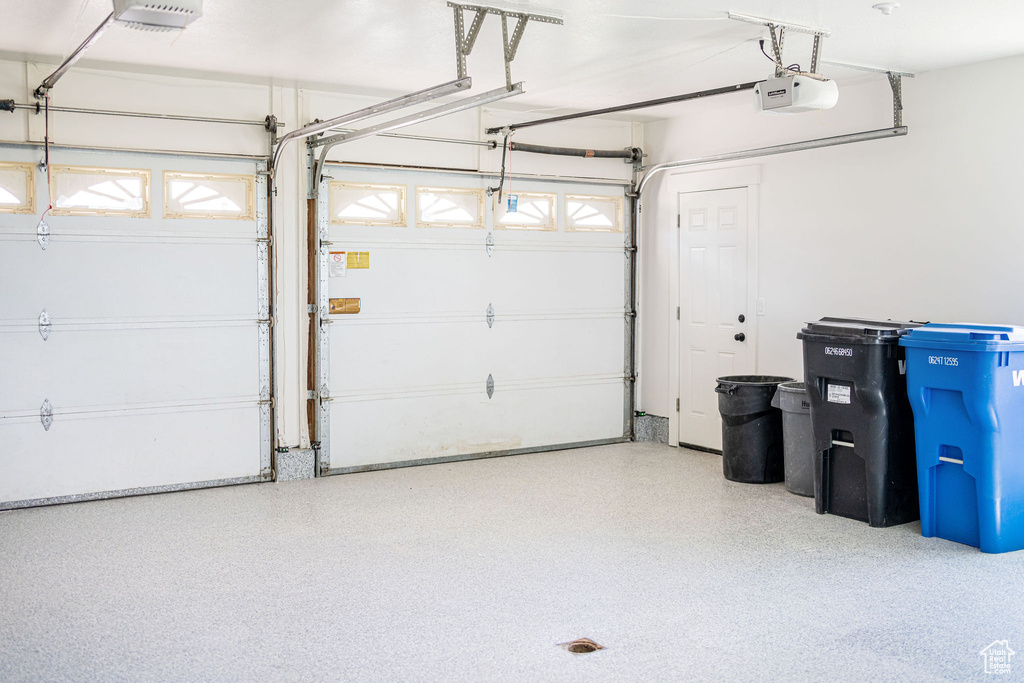 Garage featuring a garage door opener