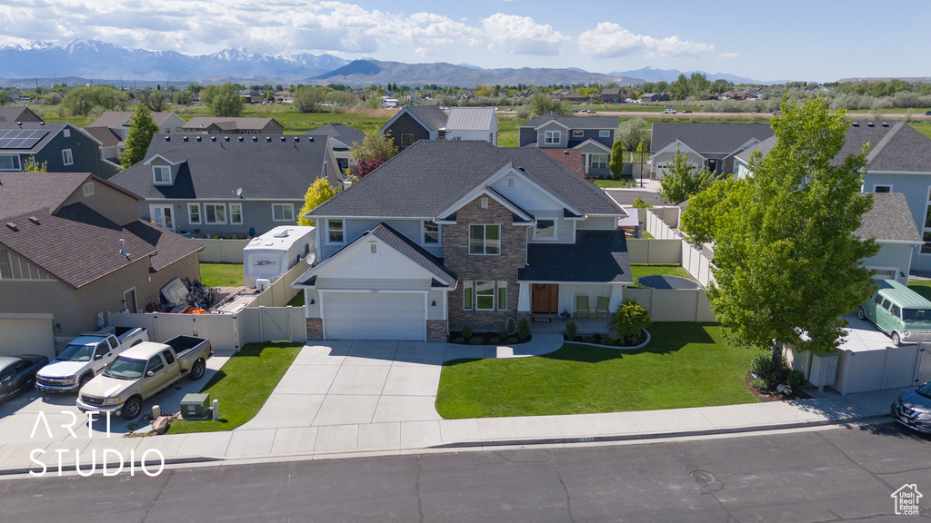 Aerial perspective of suburban area featuring a mountain backdrop