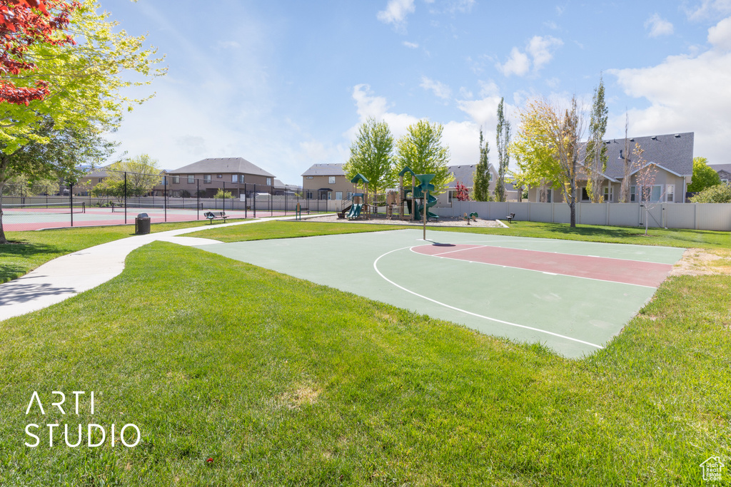 View of sport court with community basketball court, a tennis court, and a residential view
