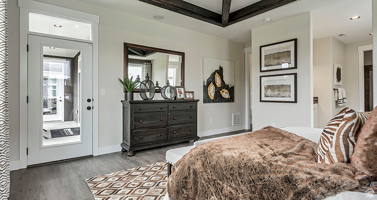 Bedroom featuring wood finished floors, recessed lighting, and baseboards