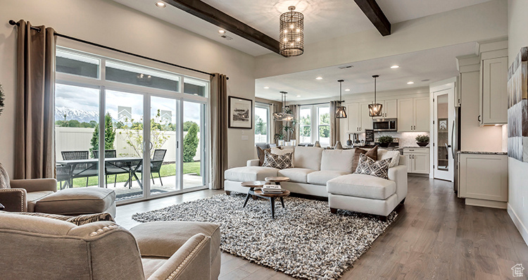 Living room with beamed ceiling, dark wood-style floors, and recessed lighting