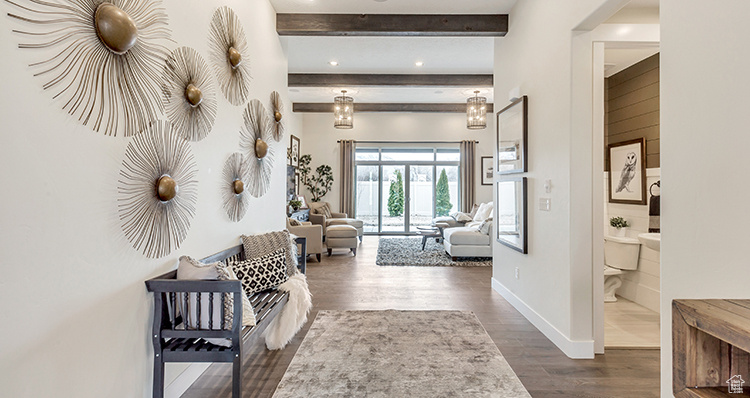 Hall featuring beam ceiling, dark wood-style floors, and baseboards