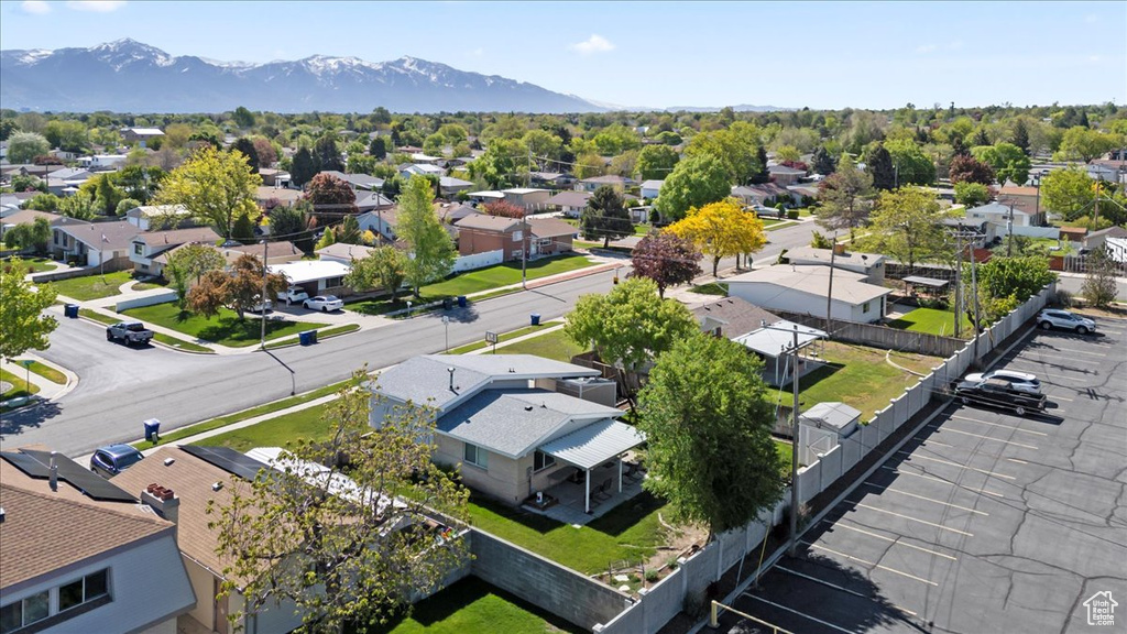 Aerial perspective of suburban area with a mountainous background