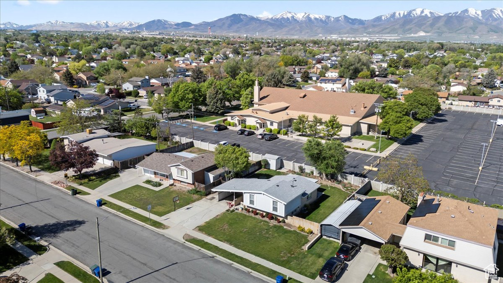 Aerial perspective of suburban area featuring a mountain backdrop