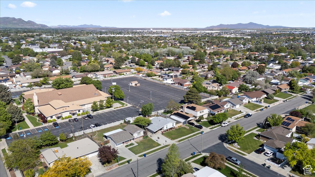 Aerial perspective of suburban area featuring a mountain backdrop