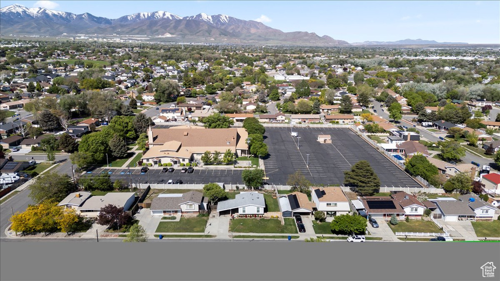 Aerial view of residential area with a mountainous background