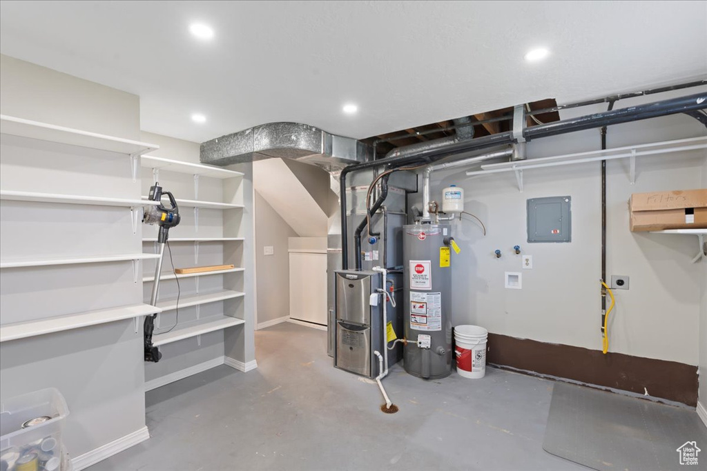 Utilities featuring gas water heater, electric panel, and heating unit