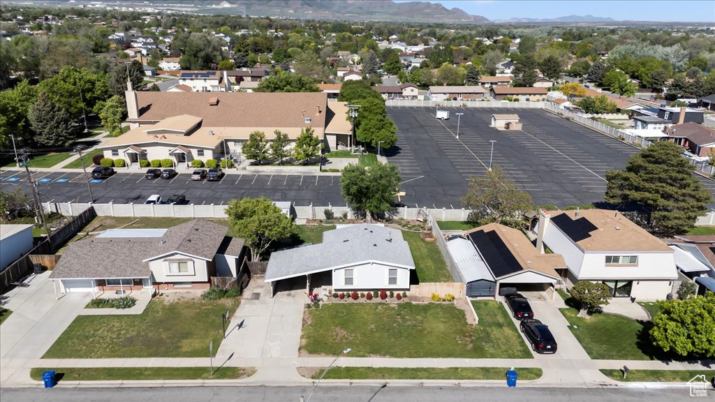 Aerial view of residential area featuring a mountain backdrop
